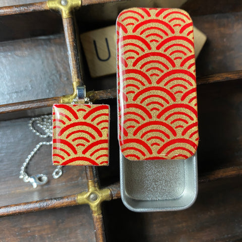 A Scrabble Tile Pendant and Teeny Tiny Tin Ocean Red