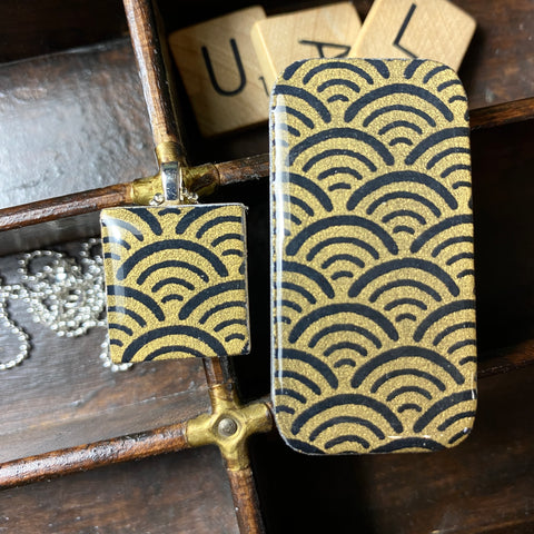 A Scrabble Tile Pendant and Teeny Tiny Tin Ocean Black