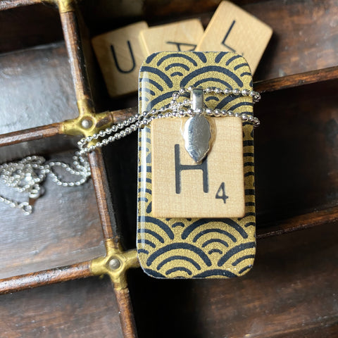 A Scrabble Tile Pendant and Teeny Tiny Tin Ocean Black