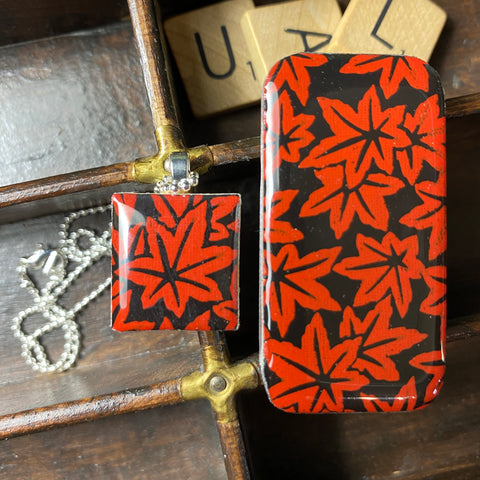 A Scrabble Tile Pendant and Teeny Tiny Tin Red Leaves