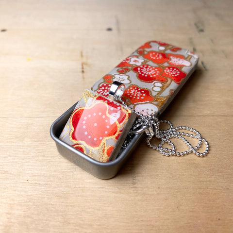 A Scrabble Tile Pendant and Teeny Tiny Tin Poppy