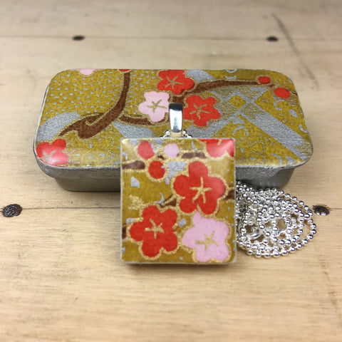 A Scrabble Tile Pendant and Teeny Tiny Tin Kim Gold