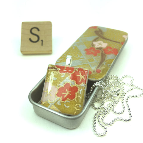 A Scrabble Tile Pendant and Teeny Tiny Tin Kim Gold